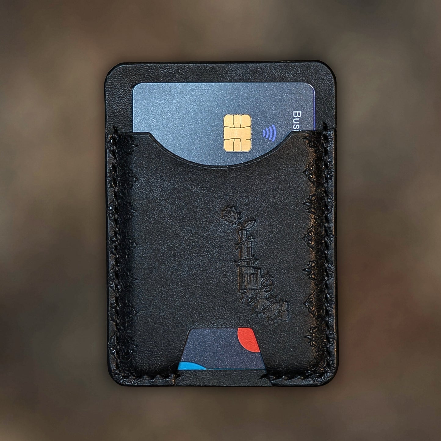 The Contra wallet in Black Italian Pueblo leather with an embossed design by EL REY LEATHER.