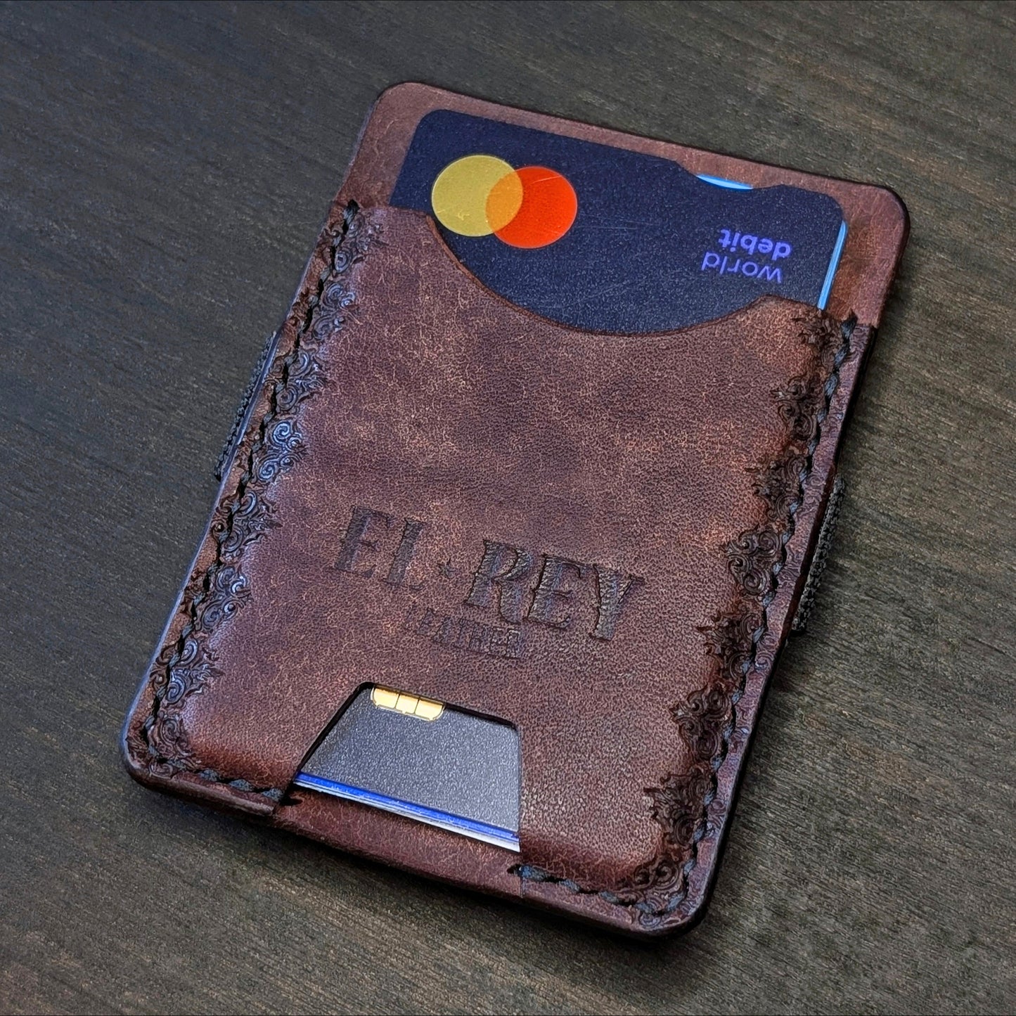 El Rey Leather Melee minimalist leather wallet in Tobacco featuring hand-stitching and stamped borders.