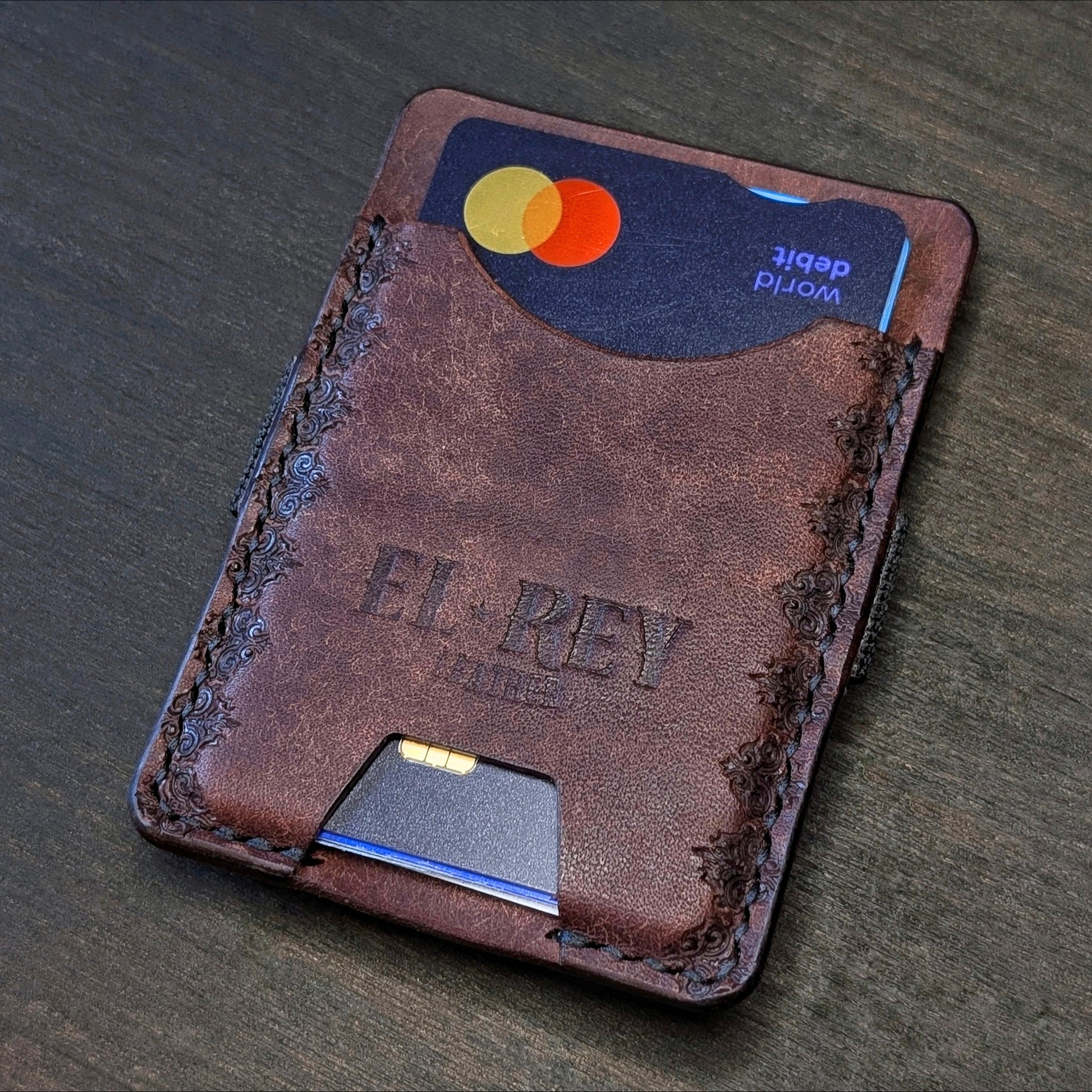 El Rey Leather Melee minimalist leather wallet in Tobacco featuring hand-stitching and stamped borders.