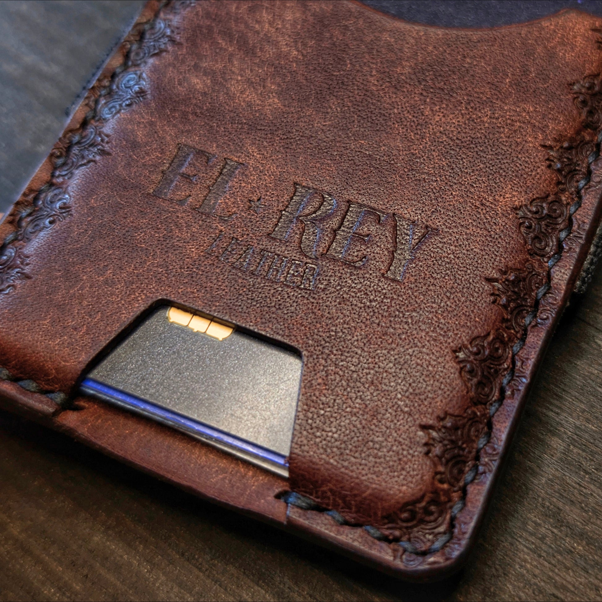 Close shot of the authentic El Rey Leather embossed maker's mark on the Tobacco Melee card holder.