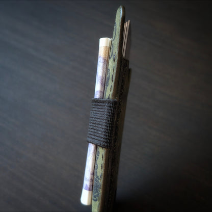 A tight closeup highlighting the ruggedly sleek profile and glass-slick, hand-burnished edges of The Melee in Olive.