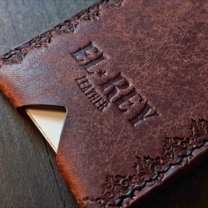 Close shot of the authentic El Rey Leather embossed logo on the tobacco Deadbeat cardholder.