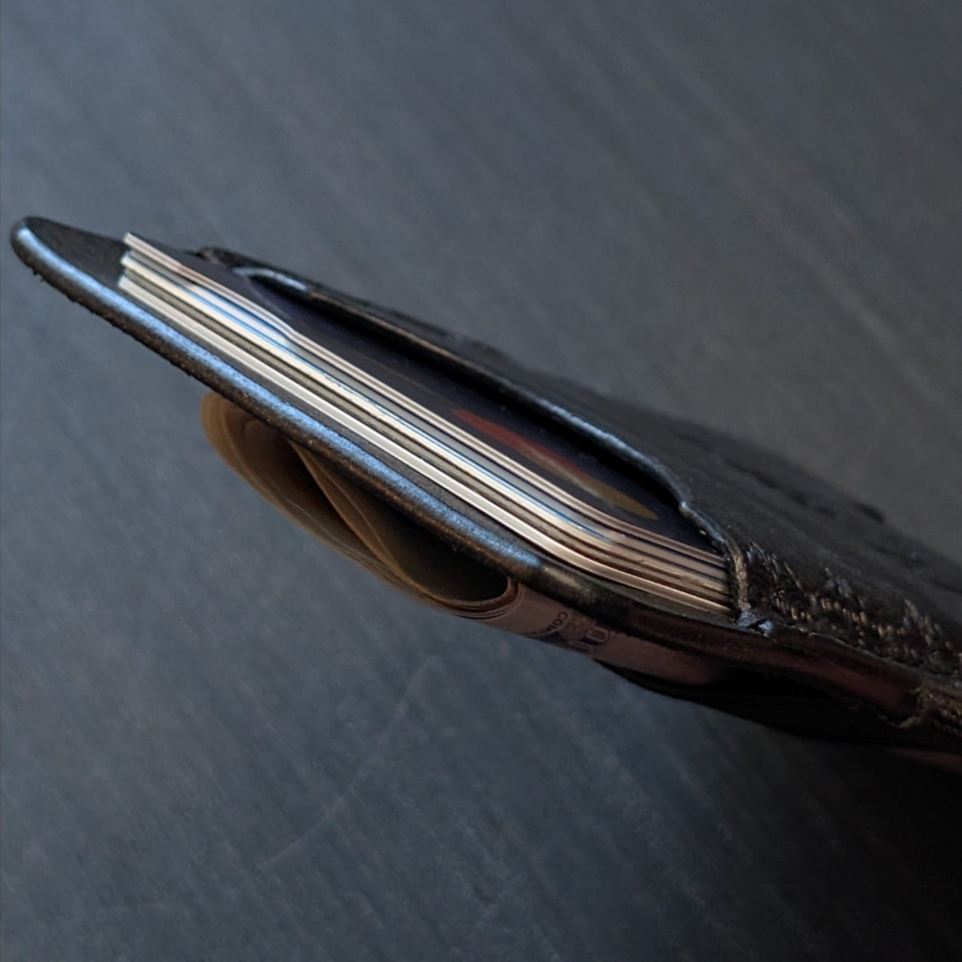 A tight closeup highlighting the ruggedly sleek profile and glass-slick, hand-burnished edges of The Melee in Black.