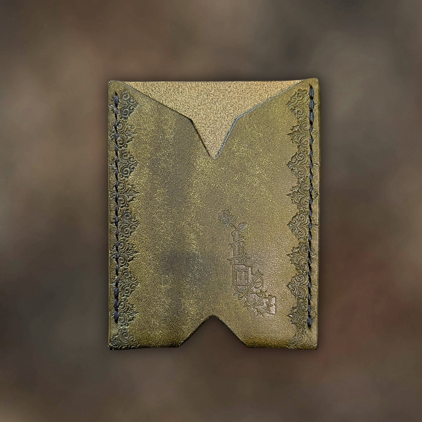 The Deadbeat minimalist wallet in olive leather with hand-struck embossed design by EL REY LEATHER.