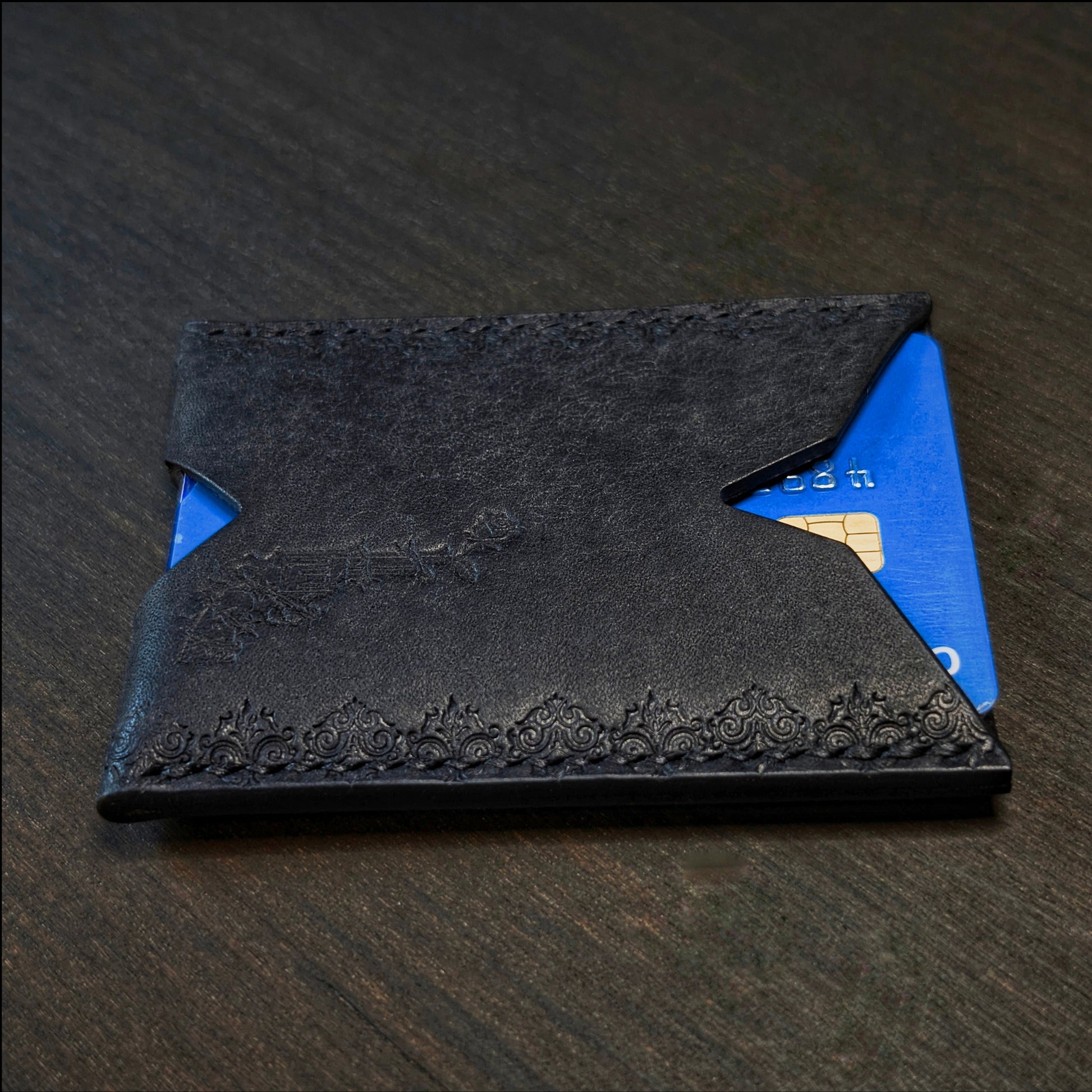 Side profile view of The Deadbeat EDC cardholder in Pueblo black leather.