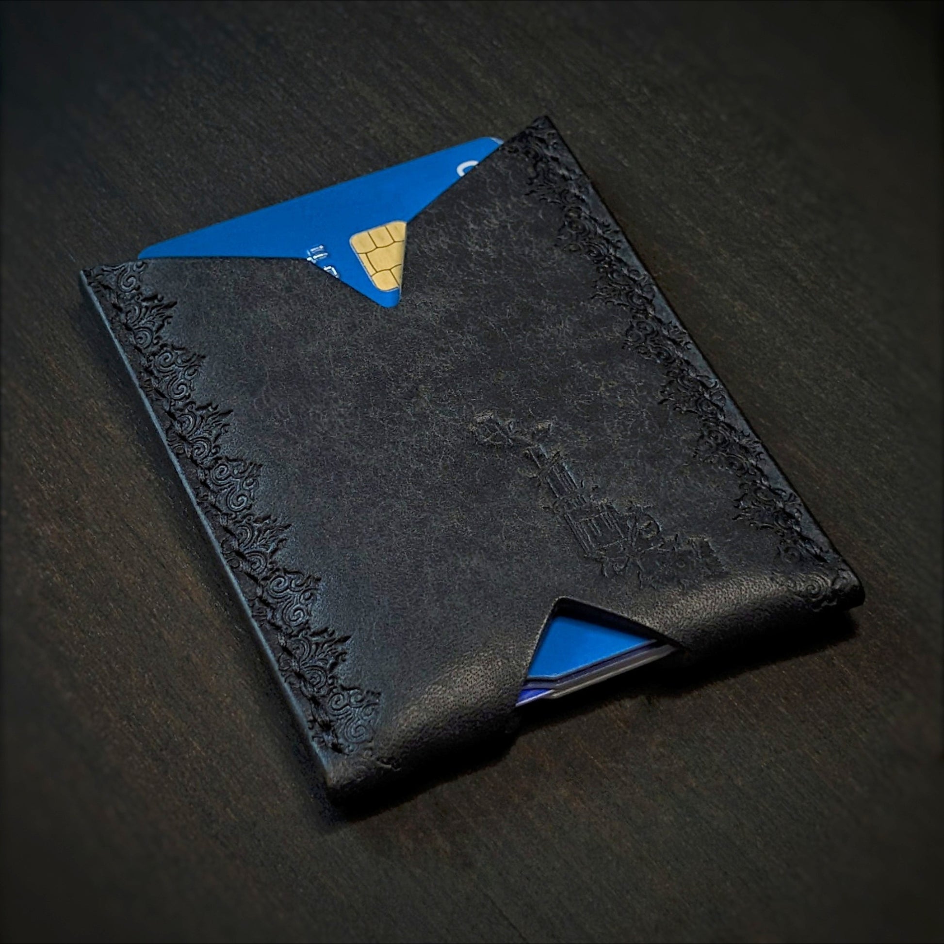 El Rey Leather Deadbeat minimalist leather wallet in black featuring hand-stitching and stamped borders.