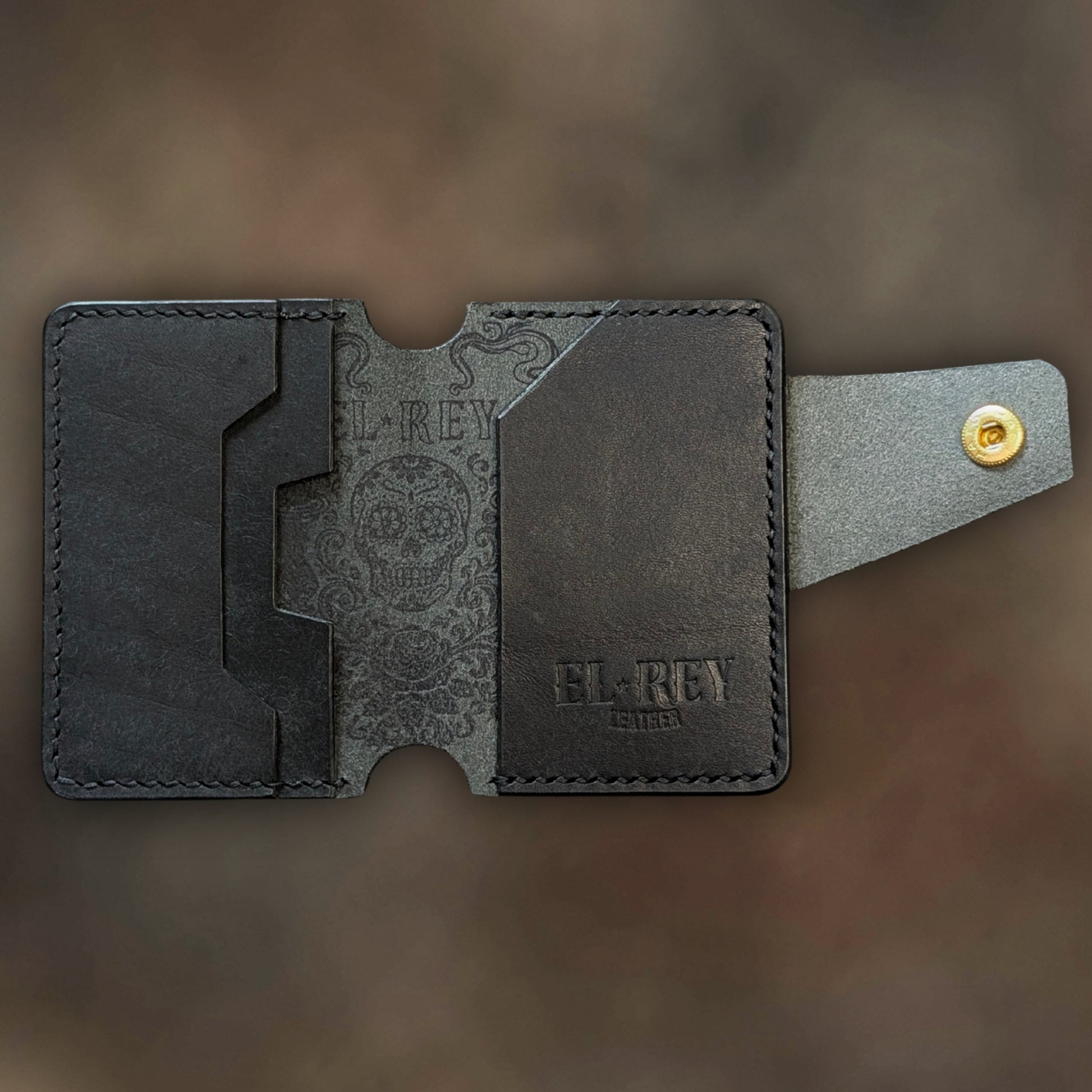Minimalist Lowlife by El Rey Leather in black leather with detailed outlaw ink skull design.