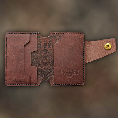 Minimalist Lowlife by El Rey Leather in tobacco leather with detailed outlaw ink skull design.