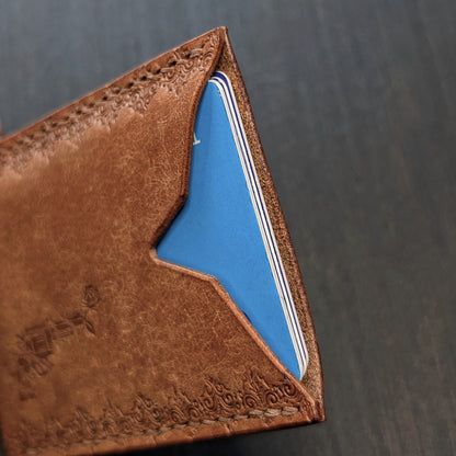 Internal pocket view of The Deadbeat slim cash and card organizer in premium cognac leather.