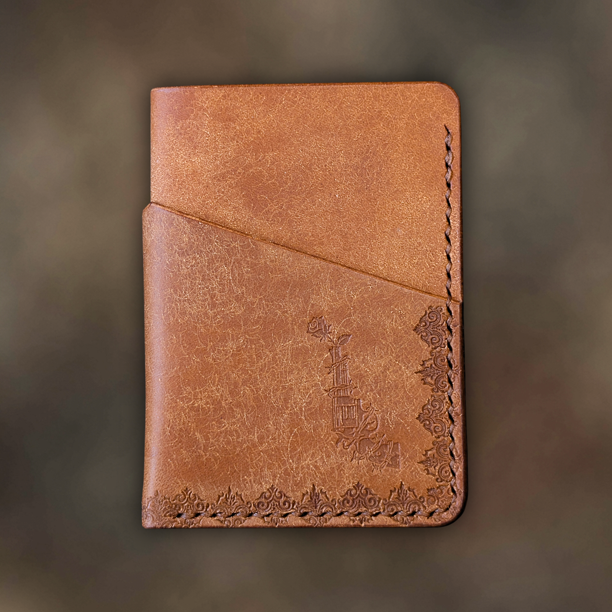 The Traitor wallet in Cognac Italian Pueblo leather with an embossed design by EL REY LEATHER.