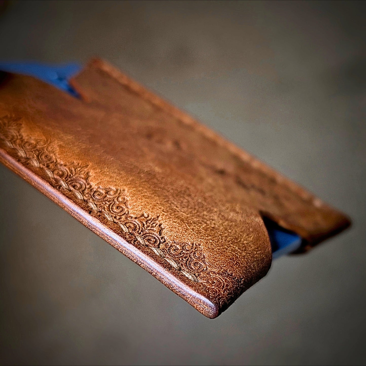 Side profile view of The Deadbeat EDC cardholder in Pueblo cognac leather.
