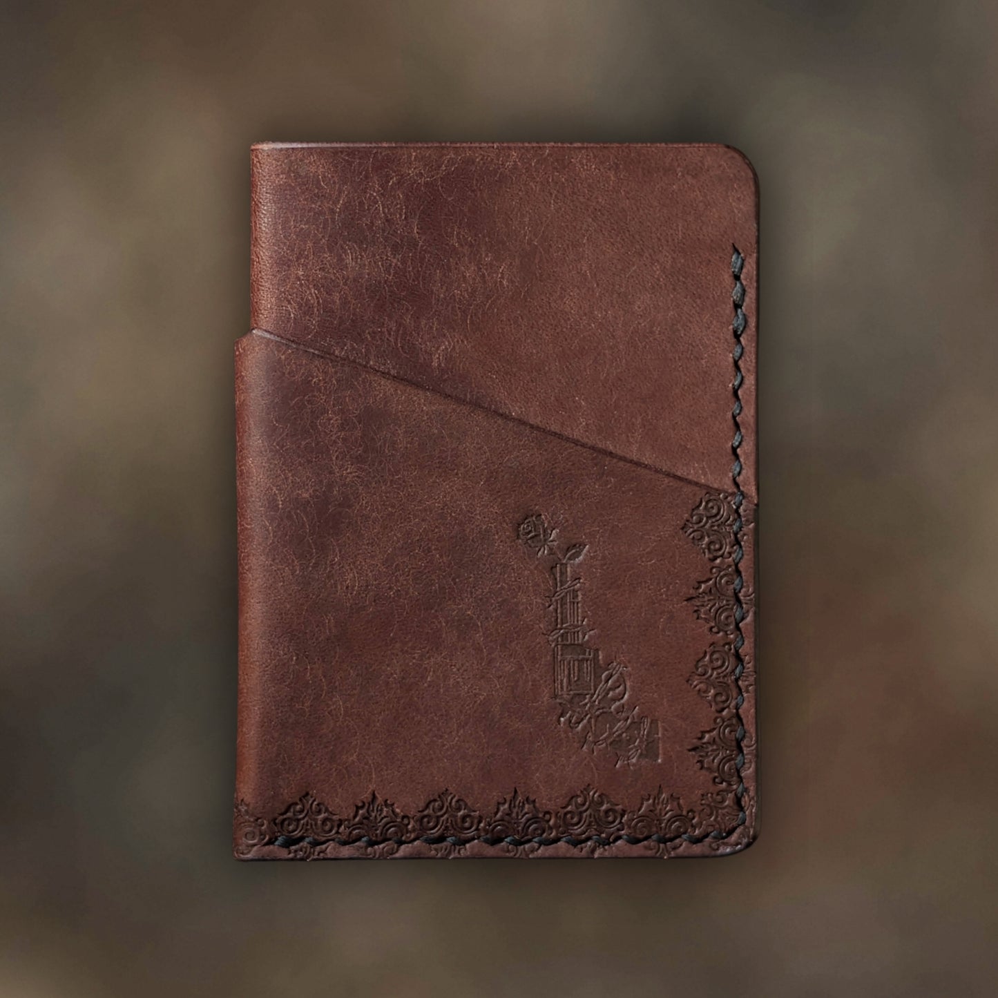 The Traitor wallet in Tobacco Italian Pueblo leather with an embossed design by EL REY LEATHER.