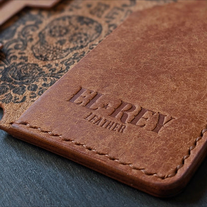 Macro shot of burnished edges and slim profile pocket design on The Lowlife cognac leather wallet.