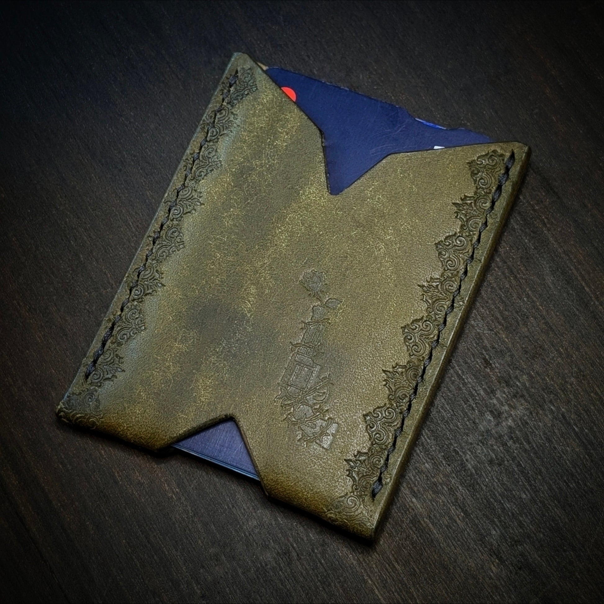 El Rey Leather Deadbeat minimalist leather wallet in olive featuring hand-stitching and stamped borders.