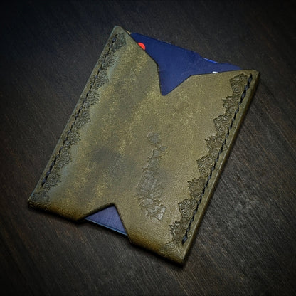 El Rey Leather Deadbeat minimalist leather wallet in olive featuring hand-stitching and stamped borders.
