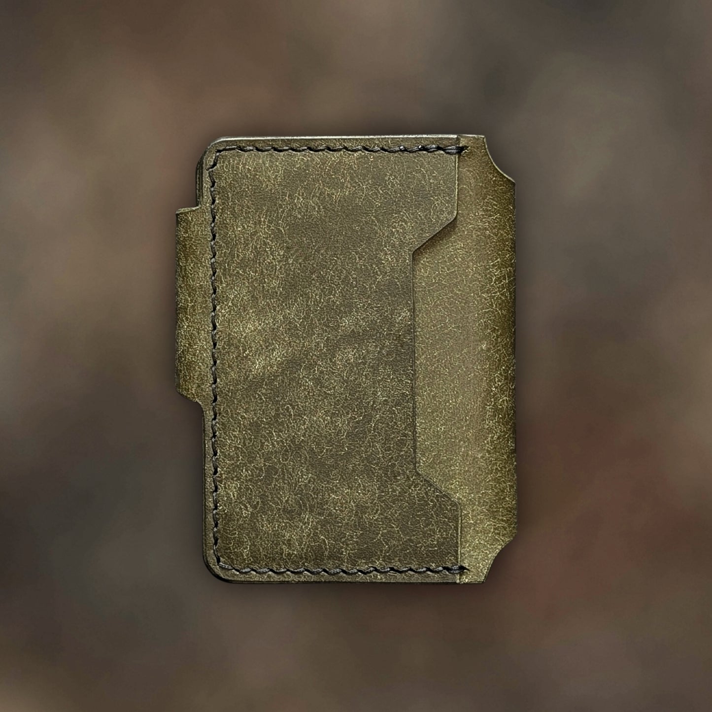 Back view of The Lowlife EDC cardholder showcasing rugged construction and premium olive leather grain.