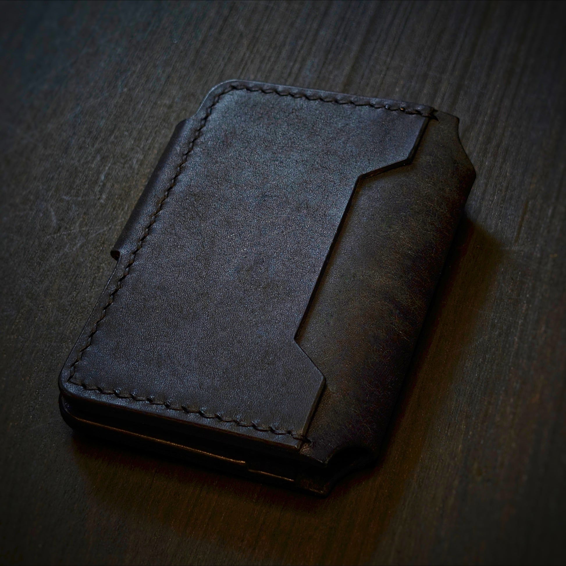 Back view of The Lowlife EDC cardholder showcasing rugged construction and premium Black leather grain.
