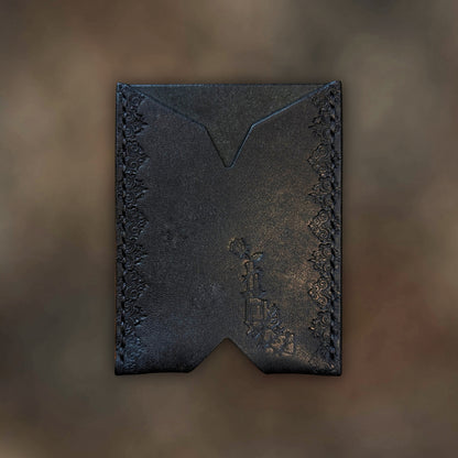 The Deadbeat minimalist wallet in black leather with hand-struck embossed design by EL REY LEATHER.