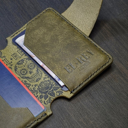 Flat lay view of The Lowlife slim cash and card organizer in premium olive leather.