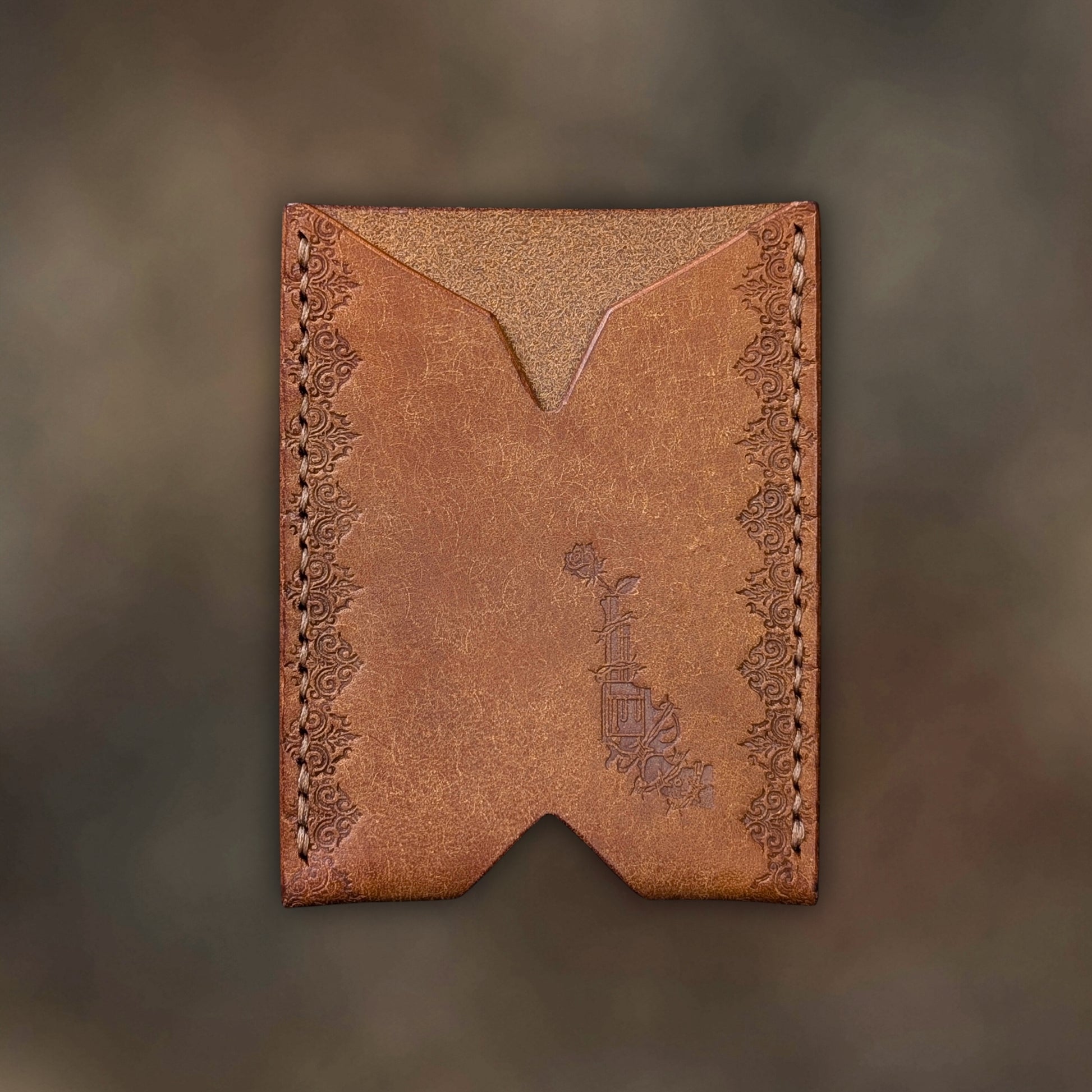 The Deadbeat minimalist wallet in cognac leather with hand-struck embossed design by EL REY LEATHER.