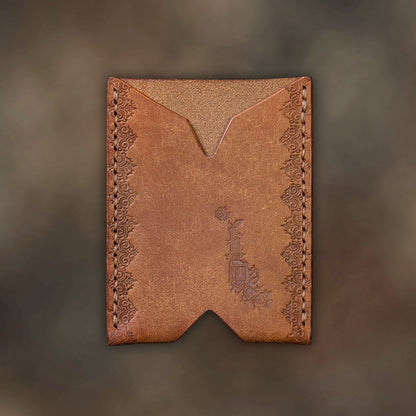The Deadbeat minimalist wallet in cognac leather with hand-struck embossed design by EL REY LEATHER.