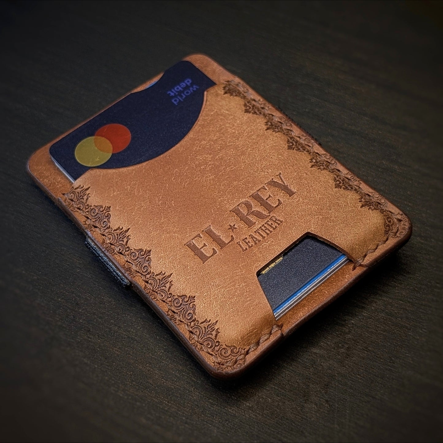 El Rey Leather Melee minimalist leather wallet in Cognac featuring hand-stitching and stamped borders.