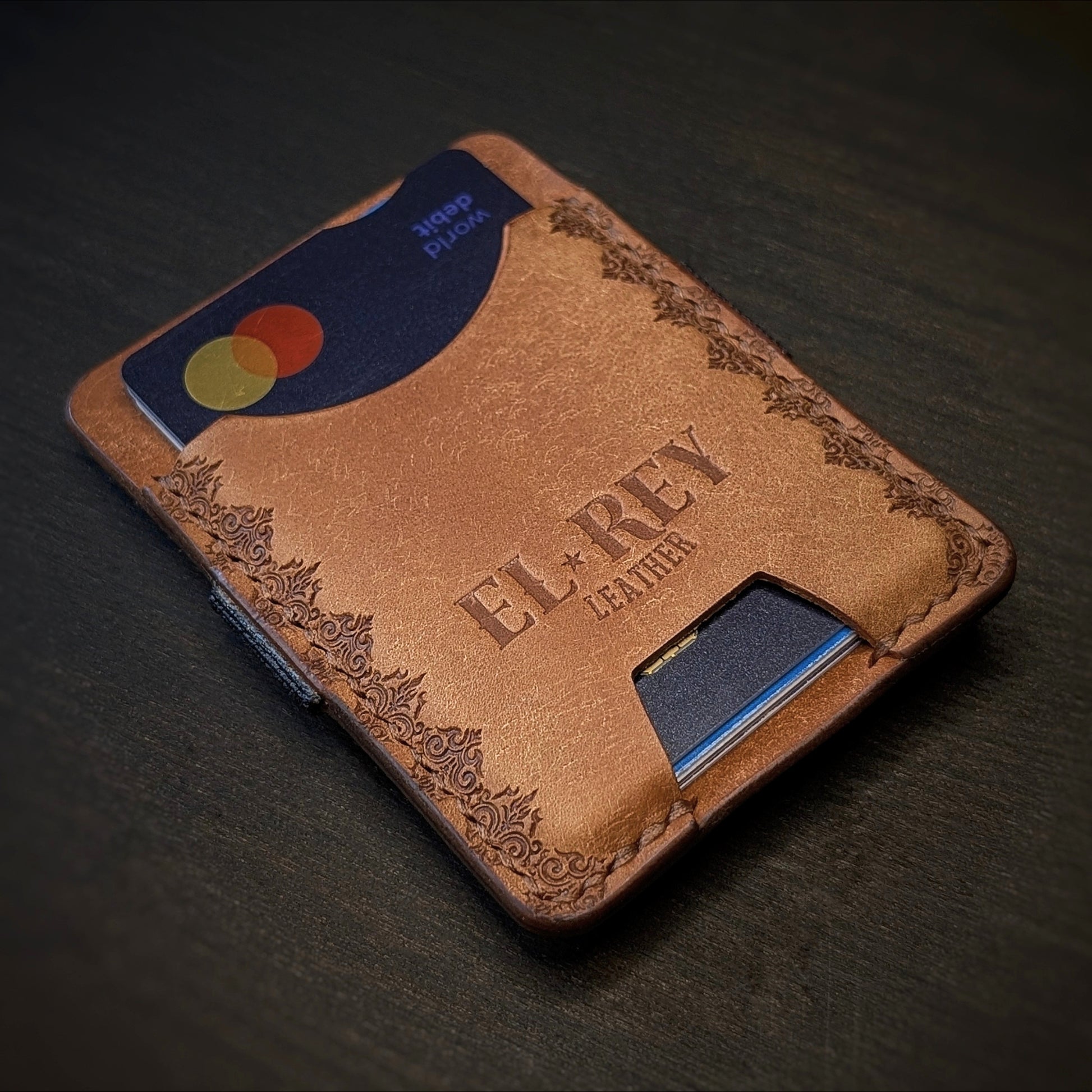 El Rey Leather Melee minimalist leather wallet in Cognac featuring hand-stitching and stamped borders.