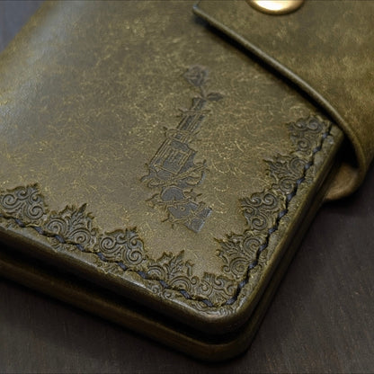 Close shot of the authentic El Rey Leather embossed maker's mark on the olive Lowlife card holder wallet.