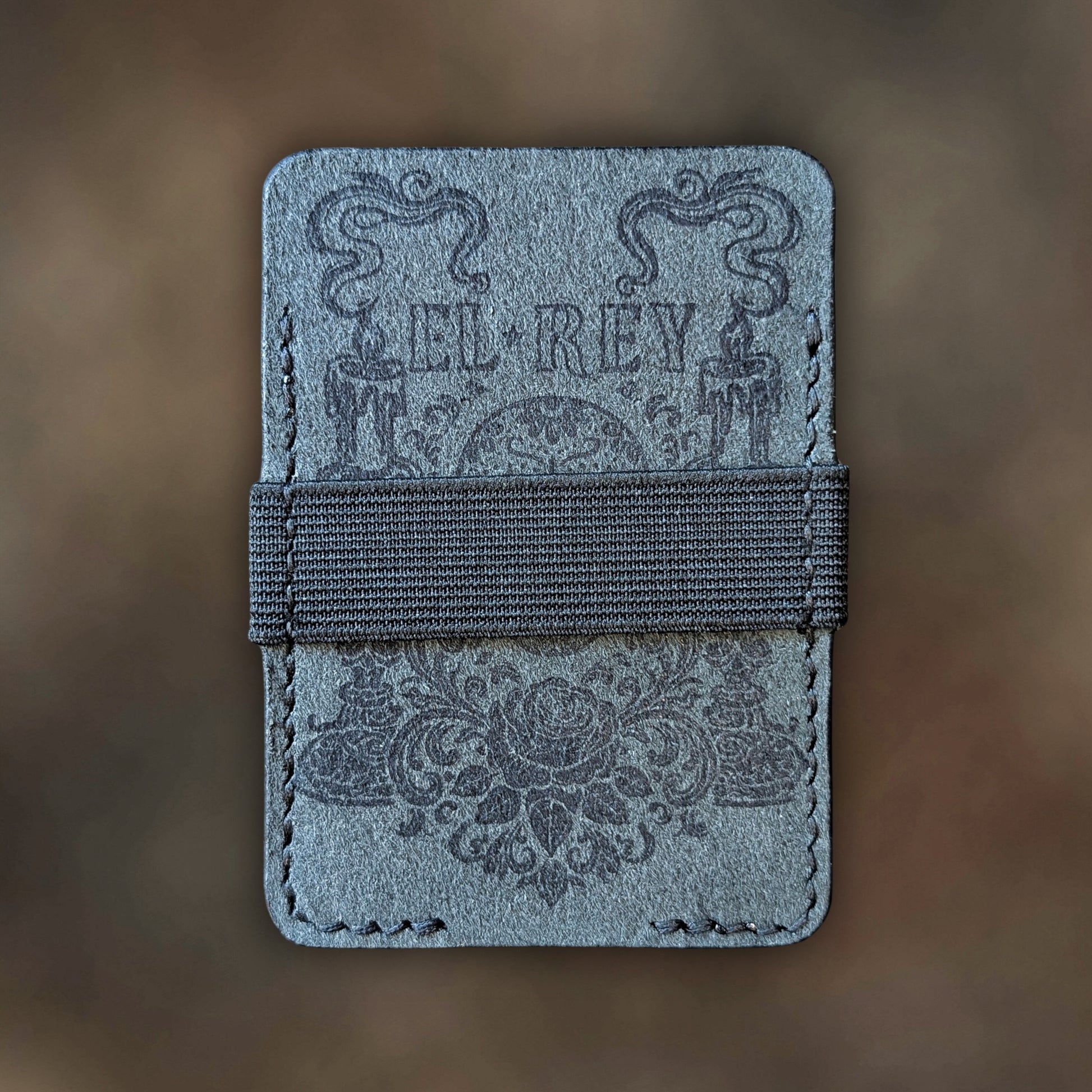 Back view of The Melee EDC cardholder showcasing rugged construction and premium Black leather grain.