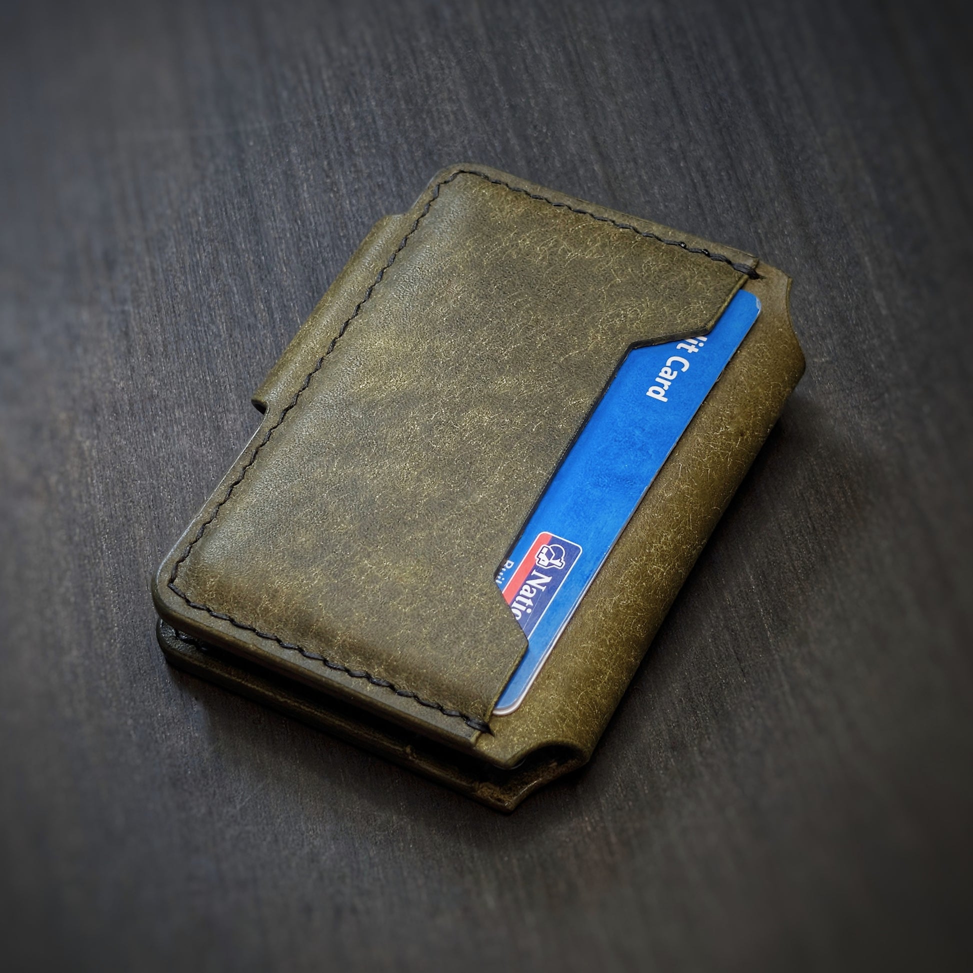 Back view of The Lowlife EDC wallet showcasing back card slot and olive leather grain.