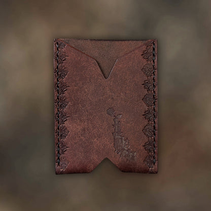 The Deadbeat minimalist wallet in tobacco leather with hand-struck embossed design by EL REY LEATHER.