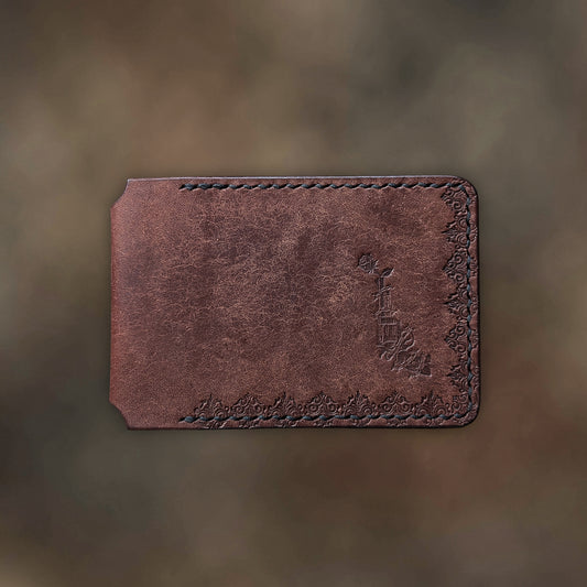 The Termite minimalist wallet in tobacco leather with hand-struck embossed design by EL REY LEATHER.
