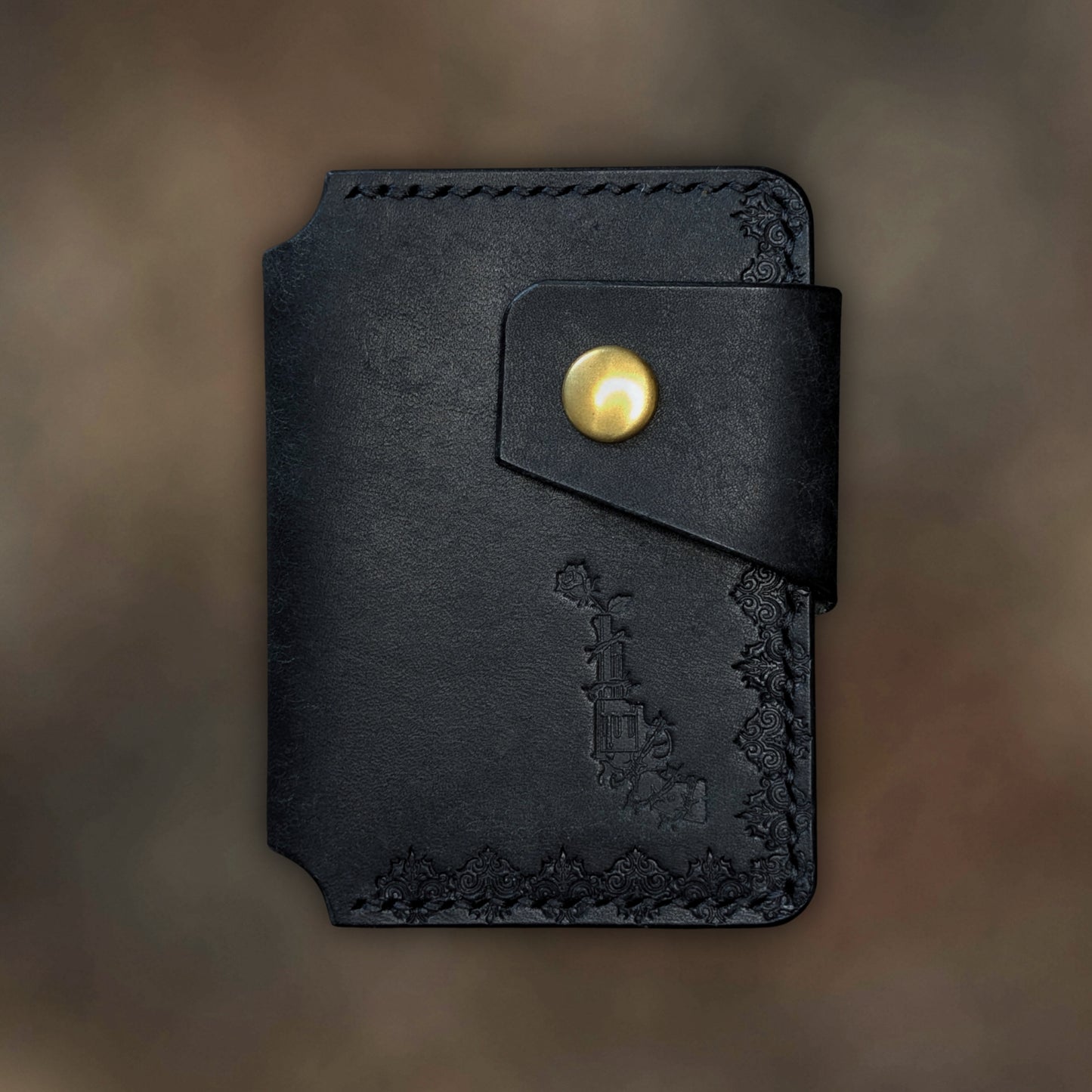 The Lowlife minimalist wallet in Black leather with hand-struck embossed design by EL REY LEATHER.