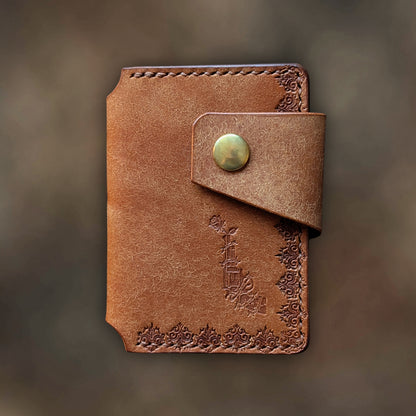 The Lowlife minimalist wallet in Cognac leather with hand-struck embossed design by EL REY LEATHER.