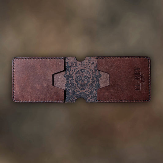 The Termite EDC wallet showcasing custom skull ink design in tobacco leather grain.